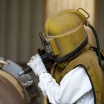 Surface preparation by sand blasting