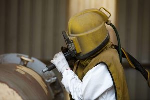 Surface preparation by sand blasting
