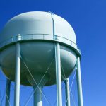 Water tower with blue sky in the background
