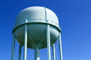 Water tower with blue sky in the background
