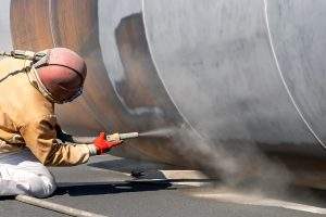 View of the sandblasting or abrasive blasting. Abrasive blasting