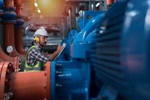 Mechanical engineer Checking of centrifugal pump in pump room. w
