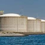 Rotterdam, The Netherlands, August 23, 2022: three large concrete oil tanks on a sunny day at Maasvlakte industrial area
