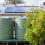 Water tank and solar panels on house