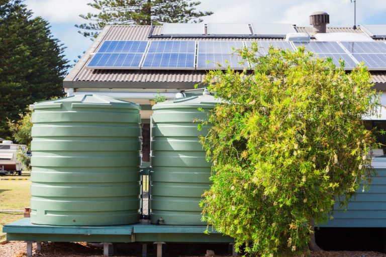 Water tank and solar panels on house